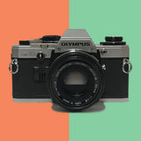 Olympus OM10 50mm f/1.8 (with leather case)